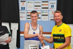 Adam Holmes collect his 2nd male finisher's prize